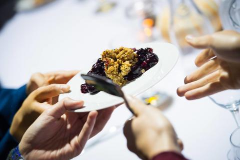 People sharing a dessert