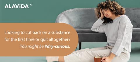 Woman with coffee cup and head in hand. Looking to cut back on a substance for the first time or quit altogether? You might be #dry-curious.