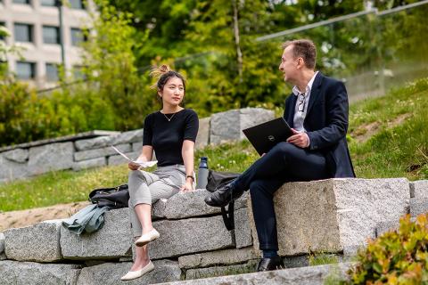 Two people sitting and talking