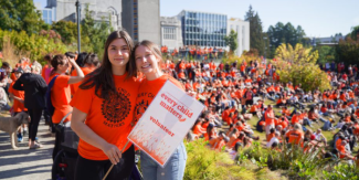 Volunteers at the Intergenerational March for the 2022 Orange Shirt Day