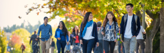 Students walking on UBC Vancouver campus in the fall.