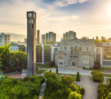 Aerial view of UBC campus including clock tower and Irving K Barber building.