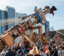 People at UBC Vancouver campus raising Haida totem pole