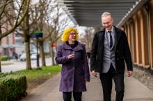 Two colleagues walking at the Vancouver campus.